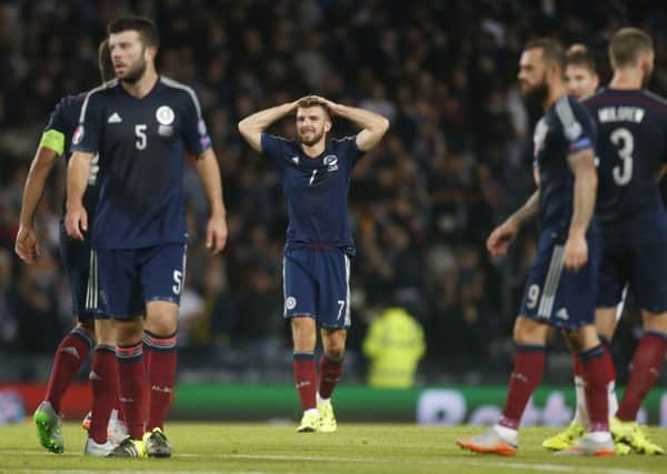 Dejection for James Morrison and Scotland after a narrow loss to Germany. Picture: PA