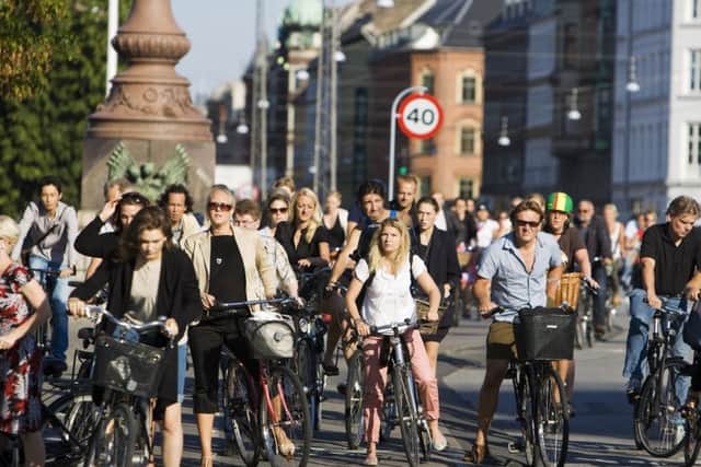 Cyclists wait at a crossing in Copenhagen. Picture: Contributed