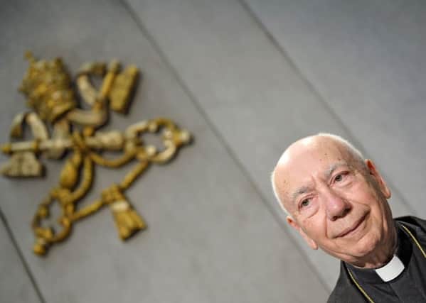 Cardinal Francesco Coccopalmerio, president of the Vatican Pontifical Council for Legislative Texts, reads Pope Francis' details on the marriage annulments reforms in the Vatican press hall on November 8, 2015. Picture: Getty Images