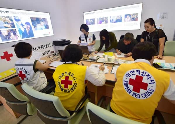South Korean officials check applications for the inter-Korean family reunion. Picture: Getty/AFP