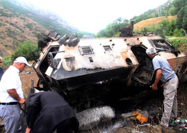 An armoured vehicle was badly damaged in the attack. Picture: Getty Images/AFP