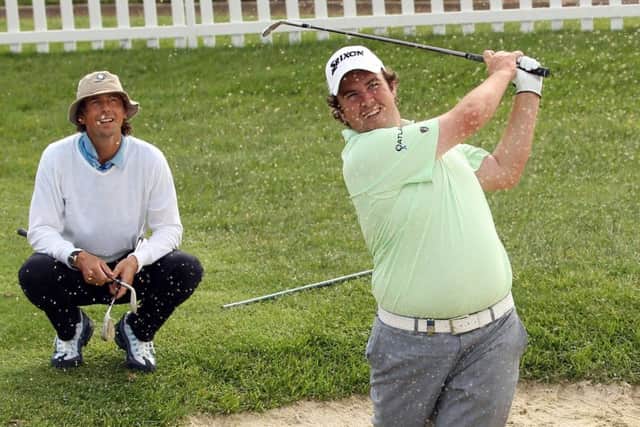 Neil Manchip watches his star pupil Shane Lowry of Ireland on the practice ground. Picture: Getty Images