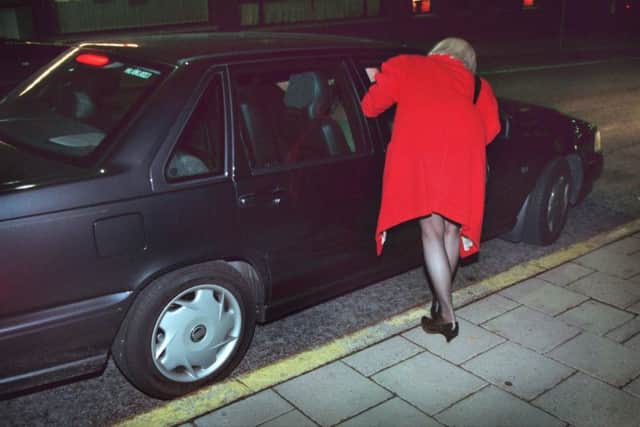 A prostitute and a motorist in central Stockholm. Purchasing sex is a criminal offence in Sweden and other Nordic nations. Picture: PA