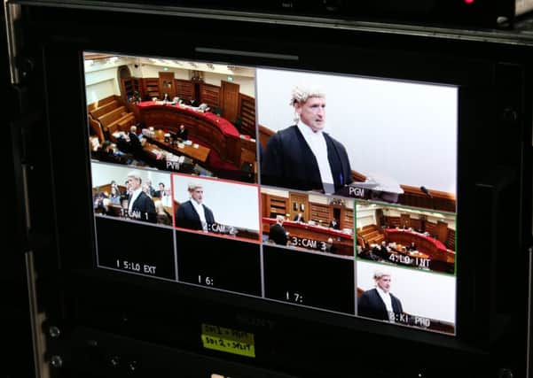 Images on a TV monitor of camera footage taken from inside the Election Court trial of Liberal Democrat MP Alistair Carmichael, at the Court of Session in Edinburgh. Picture: PA