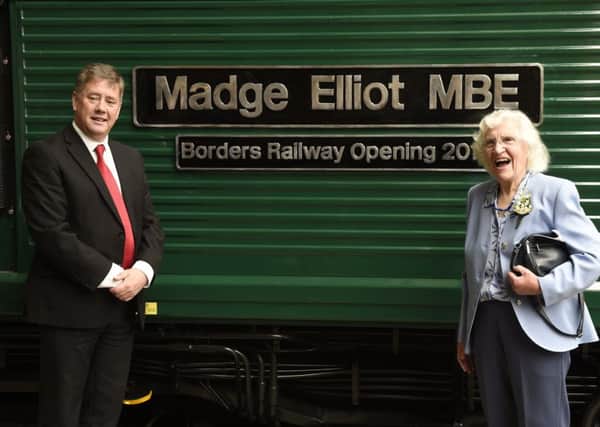 Transport Minister Keith Brown with campaigner Madge Elliot. Picture: Greg Macvean