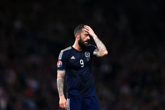 Scotland's Steven Fletcher stands dejected after being defeated by Germany at the end of their Euro 2016 Group D qualifying match. Picture: Getty Images