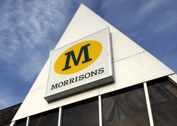 Morrisons posted a slump in first-half profits
