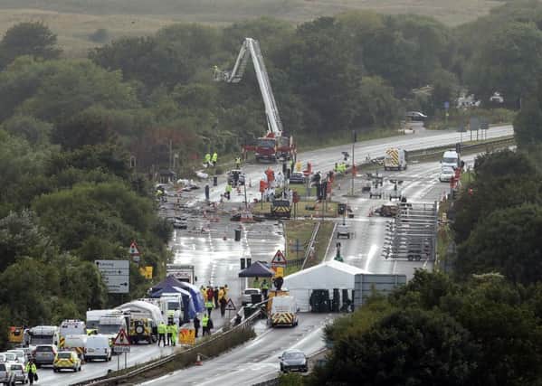 Emergency workers at the scene of the Shoreham air disaster. Picture: PA