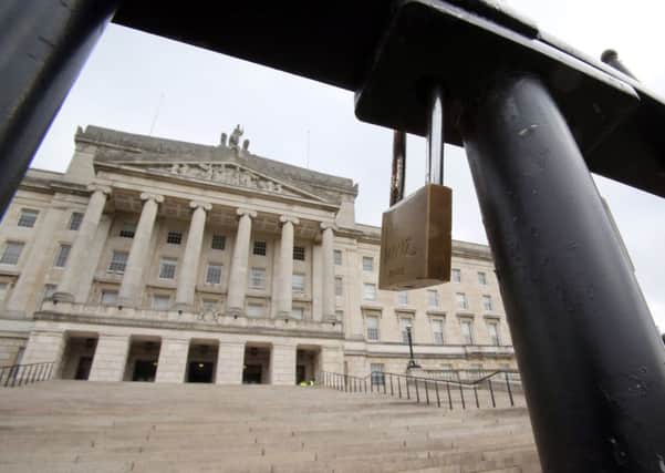 A picture shows a locked gate in front of the Stormont Parliament Buildings, the seat of the Northern Ireland Assembly, in Belfast. Picture: Getty Images
