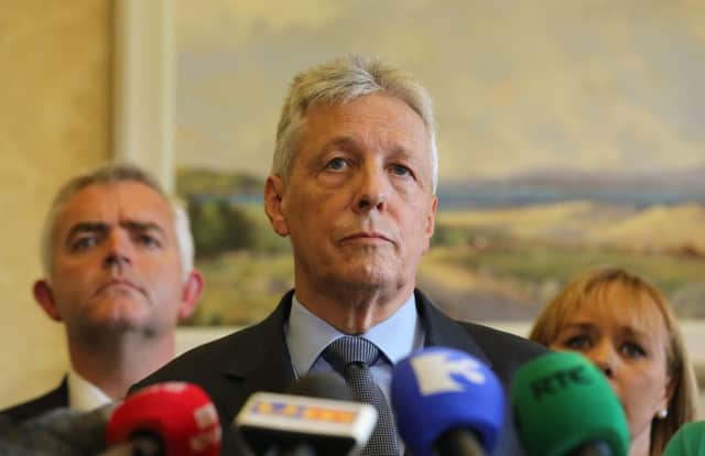 First Minister Peter Robinson announces that he is standing aside, and the majority of his ministers are to resign. Picture: PA