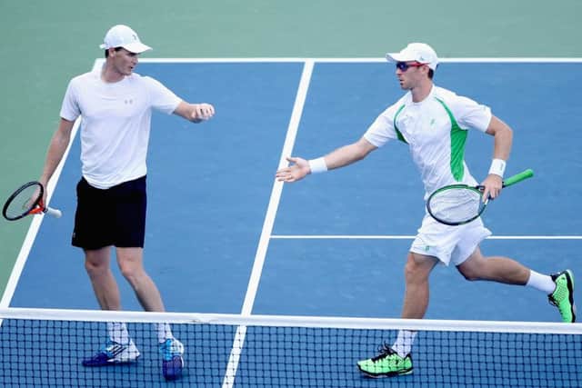 Jamie Murray and John Peers celebrate a point against Marcin Matkowski and Nenad Zimonjic. Picture: Getty