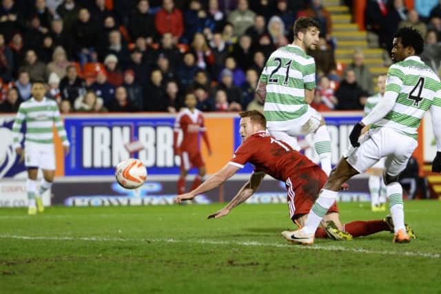 Adam Rooney scores Aberdeens second goal in their last win over Celtic, at Pittodrie in February 2014. Picture: Rob Casey/SNS