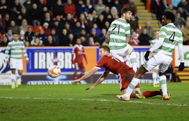 Adam Rooney scores Aberdeens second goal in their last win over Celtic, at Pittodrie in February 2014. Picture: Rob Casey/SNS