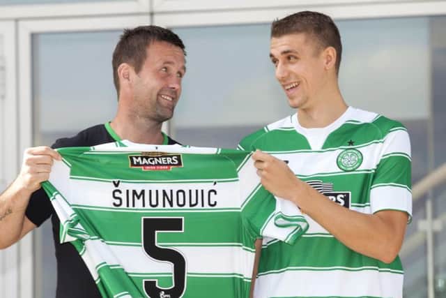 Deila (left) with new signing Jozo Simunovic, who is likely to start against Aberdeen. Picture: SNS