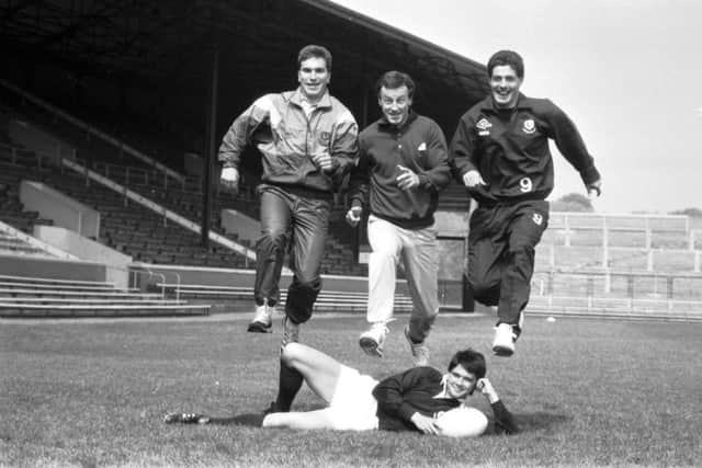 From left to right, Iwan Tukalo, Keith Robertson and Gavin Hastings, and with Roger Baird on the ground, unveil the World Cup 1987 kit supplied by Umbro. Picture: Hamish Campbell
