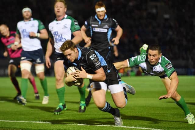 Glasgow Warriors' Glenn Bryce scores a try for the home side. Picture: SNS