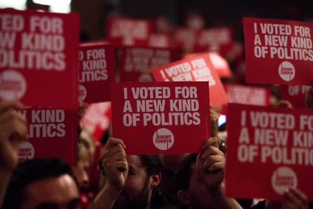 Supporters of Jeremy Corbyn hold placards. Picture: Getty
