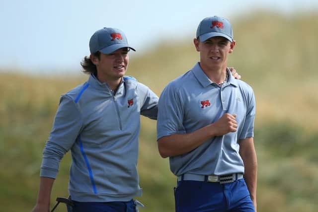 Ewen Ferguson, left, chats with with team-mate Grant Forrest during a practice round at Royal Lytham. Picture: Getty