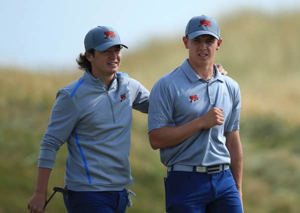 Ewen Ferguson, left, chats with with team-mate Grant Forrest during a practice round at Royal Lytham. Picture: Getty