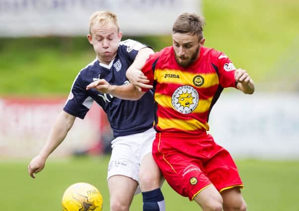Dundee's Nicky Low battles with Steven Lawless. Picture: SNS