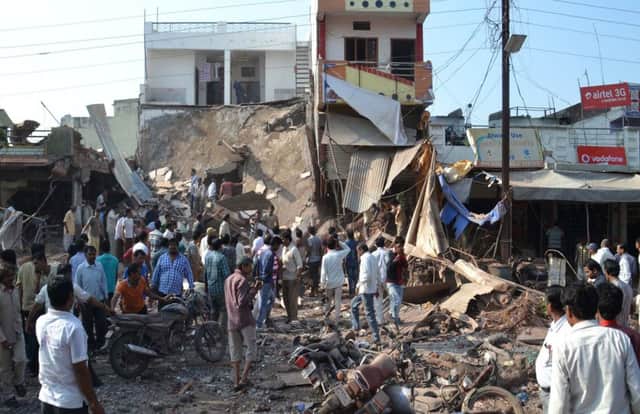 A crowd gathers at the site of the blast in Petlawad, where illegally stored detonators exploded. Picture: AP