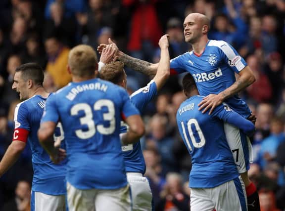 Nicky Law is hoisted high after scoring Rangers third goal against Livingston. Picture: PA