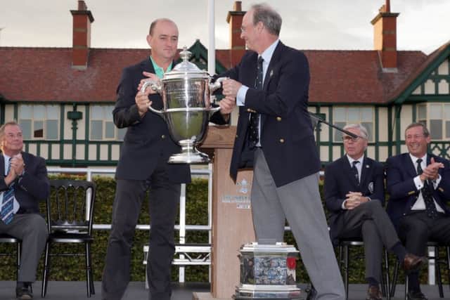 Captain Nigel Edwards Edwards receives the trophy from Royal Lytham captain Roger Berry. Picture: Getty
