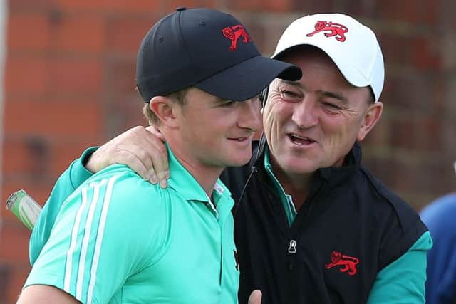 Captain Nigel Edwards celebrates with Paul Dunne. Picture: PA
