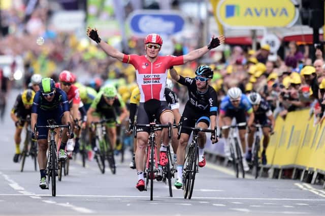Andre Greipel celebrates, only for the win to be handed to Skys Elia Viviani, right. Picture: PA
