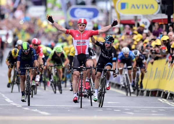 Andre Greipel celebrates, only for the win to be handed to Skys Elia Viviani, right. Picture: PA