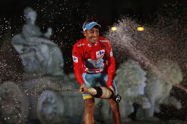 Fabio Aru from Italy celebrates in front of the Cibeles statue after winning the Vuelta in Madrid. Picture: AP