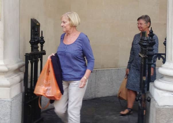 Susan Crane, left, leaves court. The 69-year-old secretary of the scheme was ordered to repay just over 81,000. Picture: PA