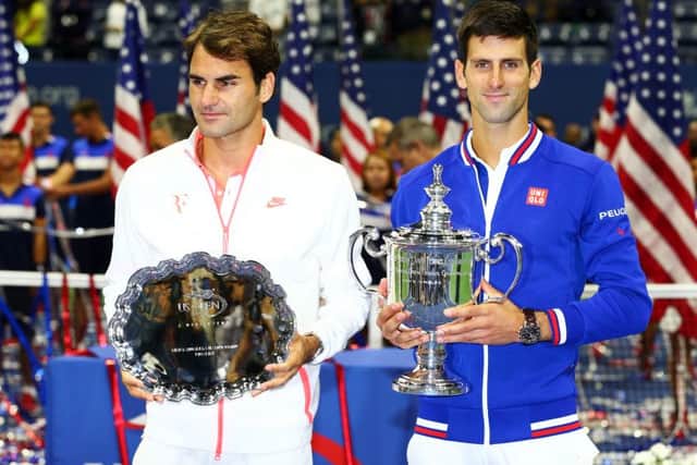 Roger Federer and Novak Djokovic receive their trophies at USTA Billie Jean King National Tennis Center. Picture: Getty