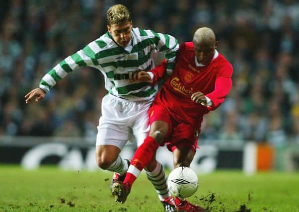 El Hadji Diouf holds off Stiliyan Petrov during the match at Parkhead. Picture: Getty