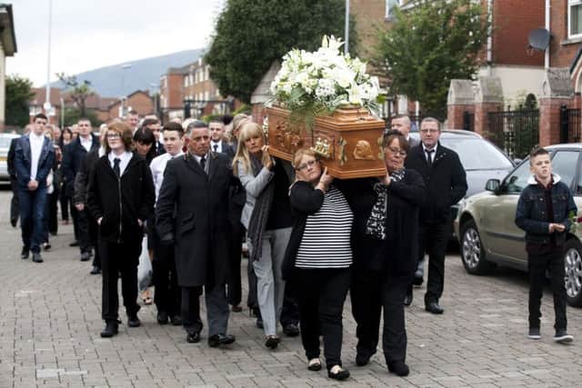 The coffin of Kevin McKee is carried to St Peter's Cathedral in Belfast. Picture: PA