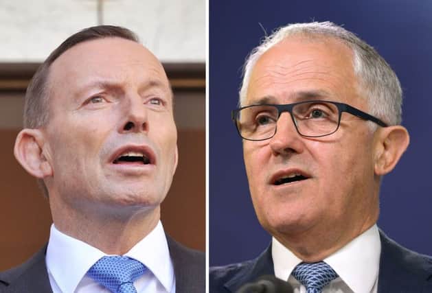 Tony Abbot, left, ousted by rival Malcolm Turnbull. Picture: AFP/Getty Images
