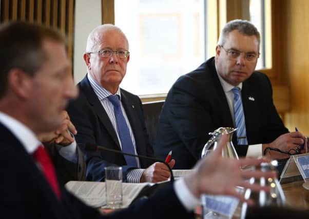Bruce Crawford, centre, has written to the Scottish Secretary to indicate his dissatisfaction with Westminster's devolution bill. Picture: Andrew Cowan/Scottish Parliament