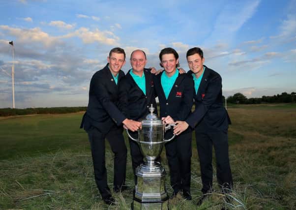 Victorious Great Britain & Ireland Walker Cup captain Nigel Edwards, second from left and the Scots members of his team, Grant Forrest, left, Ewen Ferguson, second from right, and Jack McDonald. Picture: David Cannon/R&A/Getty