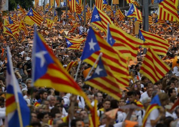 People wave Catalan flags, known as the Estelada flag, during a pro-independence rally on September 11th. Picture: AP
