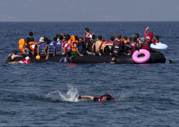 A dinghy full of refugees approaches the Greek island of Lesbos. Picture: AP
