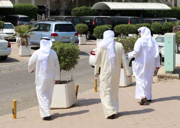 Kuwaitis arrive at the Palace of Justice where the defendants were sentenced. Picture: AFP/Getty