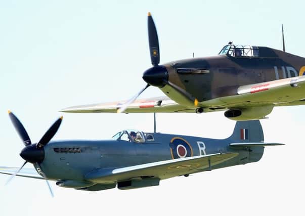 The two symbols of the Battle of Britain, a Spitfire and Hurricane, during the flypast. Picture: Getty