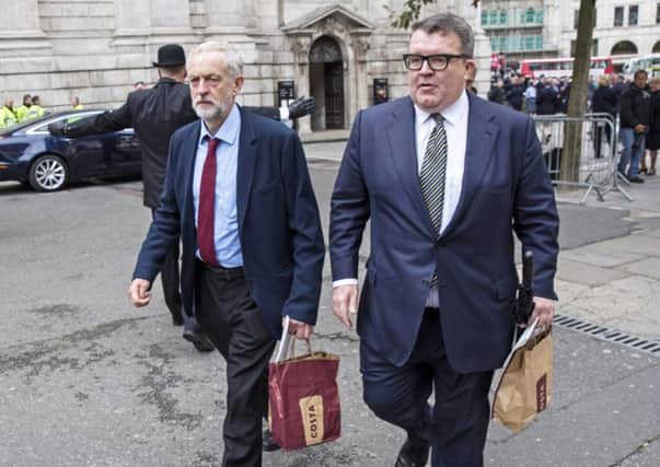 Corbyn and his deputy Tom Watson after leaving the service. Picture: Getty