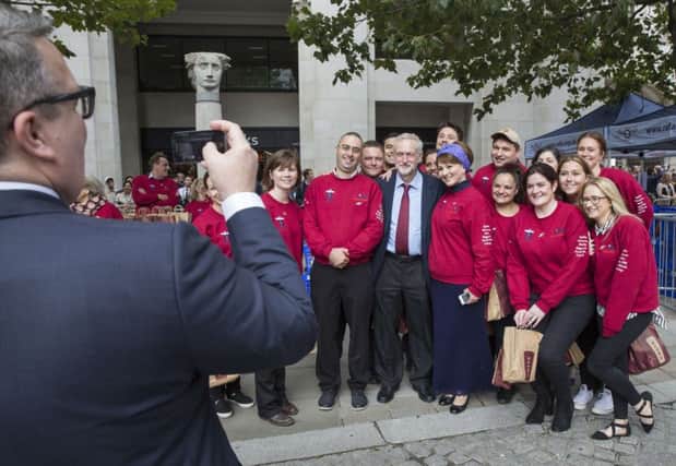 Jeremy Corbyn has his photograph taken with a younger generation of fans. Picture: Getty