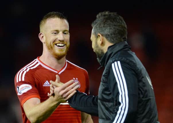 Derek McInnes congratulates match winner Adam Rooney after Aberdeen's 1-0 victory over Hamilton. Picture: SNS
