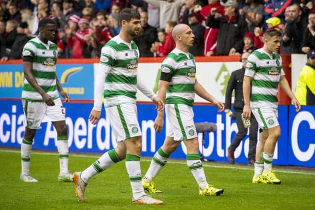 Leigh Griffiths has played down talk of disharmony at Celtic while Ronny Deila has vowed to turn things around. Picture: SNS