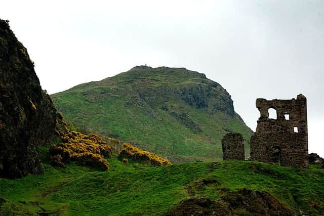 ARTHUR'S SEAT IN HOLYROOD PARK IN EDINBURGH WITH RUIN OF ST ANTHONY'S CHAPEL AT RIGHT.