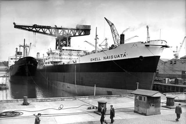 The 33,000-ton tanker Shell Naiguata in the Fairfields fitting out basin, berthed alongside the 10,000-ton cargo ship Yorkshire in August 1960