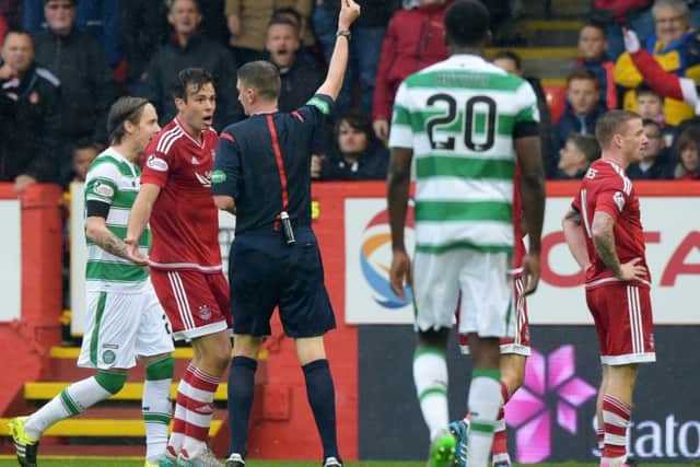 Aberdeen's Jonny Hayes (right) is shown a red card against Celtic Picture: Alan Harvey/SNS