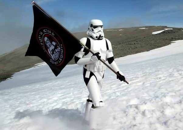 Ashley Broomhall in dressed in his Stormtrooper outfit as he climbs Ben Nevis. Picture: Hemedia